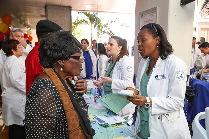 Nursing student speaking with lady