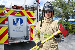 Female student wearing firefighter gear