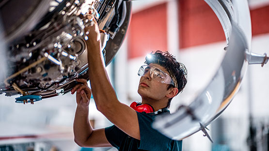 Technician working on a place engine