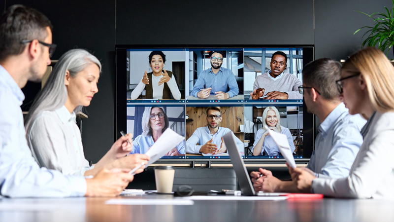 Group of people meeting with other members via a virtual call