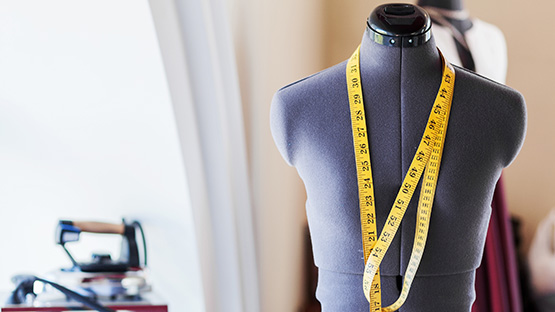 Mannequin with tape measure in a fashion design studio