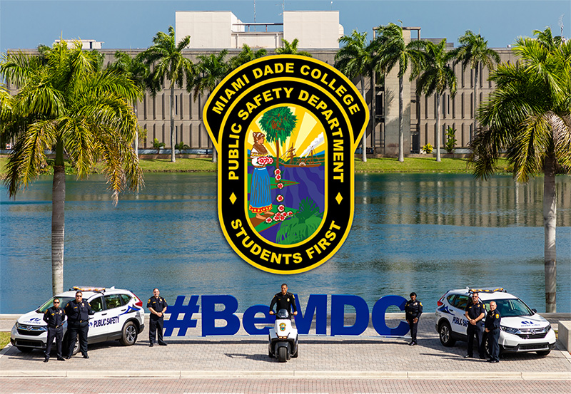 Image of public safety officials in front of a Be MDC sign