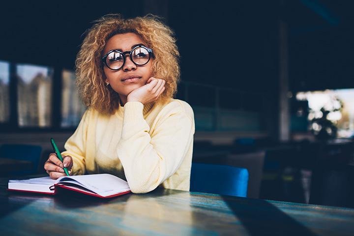 student reading  on a desk