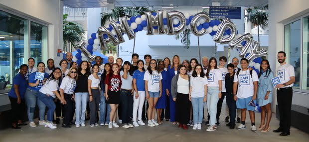 Large group of students pose at Padron Campus